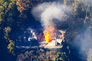 Flames leap from the ventilation shaft at the Pike River Mine. Photo / Mark Mitchell