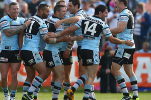 Michael Gordon of the Sharks celebrates with his team mates after scoring a try during the round 20 NRL match between the Cronulla Sharks and the Penrith Panthers. Photo / Getty Images.