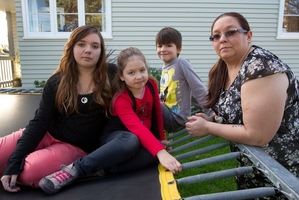 Michelle Gordon with three of her four children Jessica, 14, Caitlyn, 8, and Caleb, 8, at their Naenae home. Photo / Mark Mitchell