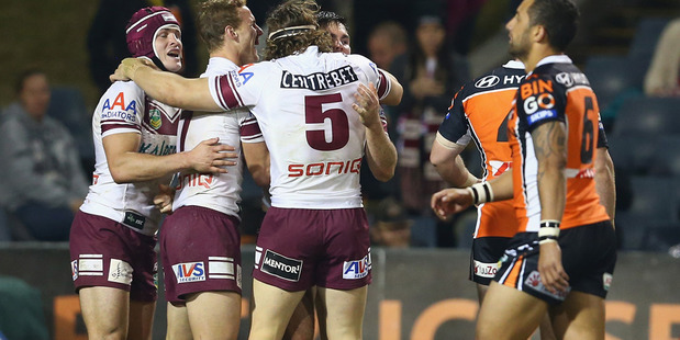 Jamie Lyon of the Sea Eagles celebrates with his teammates after scoring a try against the Wests Tigers. Photo / Getty Images