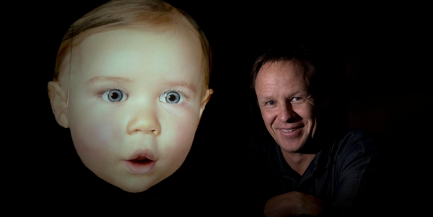 Dr Mark Sagar with Baby X, a computer-driven simulation based on his own daughter. Photo / Brett Phibbs