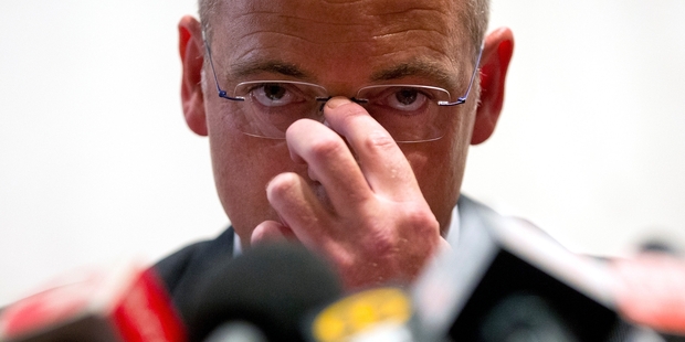 Fonterra chief executive Theo Spierings fronted media in Beijing and by teleconference to New Zealand last night and apologised to Kiwi parents. Photo / AP