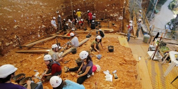 Workers carrying out an excavation at the Gran Dolonia site, part of the Archaeological Site of Atapuerca, in the Sierra de Atapuerca, province of Burgos. Photo / AFP