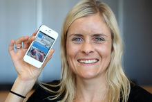 Dr Helen Eyles of the National Institute for Health Innovations shows the food package scanning iPhone app Foodswitch.Photo / Chris Gorman 