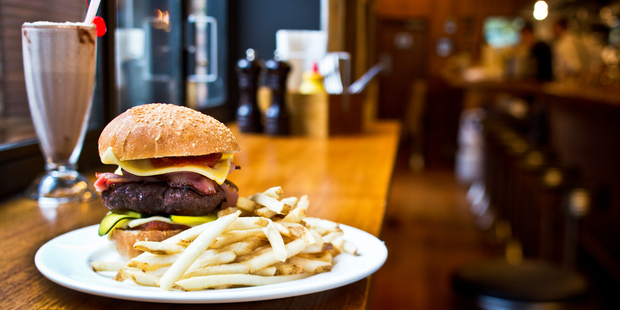 The bacon and cheese burger with fries on the menu at The Late Night Diner restaurant in Ponsonby. Photo / Babiche Martens