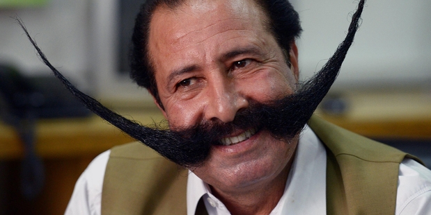 Malik Afridi was kept in a cave for a month until he agreed to shave off his greatest accessory, but that was not the end of it. Photo / AFP