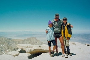 A family photograph shows Marty Schmidt (centre) with his children Sequoia Di Angelo (left) and Denali Schmidt.