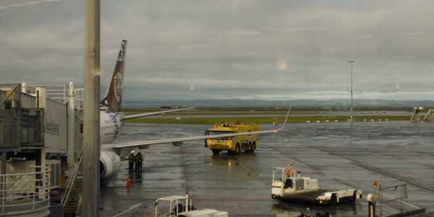 The Fiji Airways plane at Auckland Airport with emergency services close-by. Photo / supplied