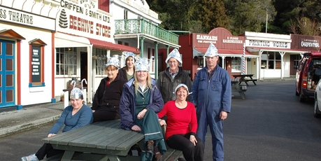 Heritage park Shantytown staff Chantelle Cronn, left, Monica Pfeifer, Hazel Large, Amanda Pike, Ian Tibbles, Andrea Forrest and Nathan Lee are prepared for any extraterrestrial visitors.