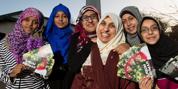 Anjum Rahman, centre with light scarf, with supporters, from left, Suad Guya, Khatra Omar, Aaminah Ghani, Sarah Ather and Aasiya Ather. Photo / Stephen Barker