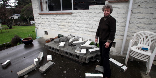 Dawn Daunauda seen outside 17 Clifford Street, Seddon, with earthquake damage. Photo / Tim Cuff