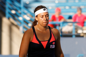 Marion Bartoli, from France, walks off the court during a match against Simona Halep, from Romania, at the Western & Southern Open tennis tournament, Wednesday, Aug. 14, 2013, in Mason, Ohio. With