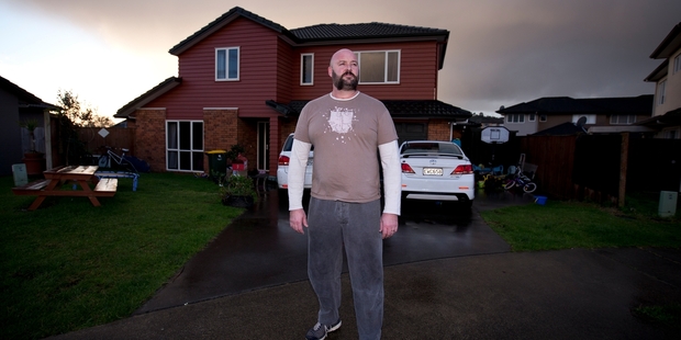 Darren Priest outside his home in Flat Bush where his rates have increased by 18.6 per cent. Photo / Dean Purcell