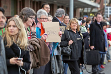 Commuters attempting to hitch-hike home after all train services were cancelled on August 16. Photo / Getty Images