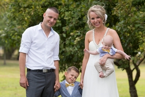 Justin Crockett, who has a brain tumour, with wife Jane and sons Chase and baby Koen. Photo / Dean Carruthers