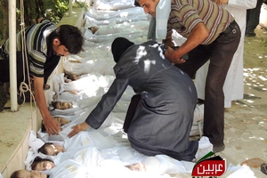 A Syrian woman mourns over the dead bodies of children after the alleged poison gas attack. Photo/ AP