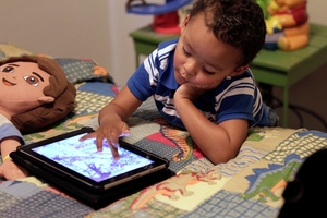 Educational researchers say preschoolers are obsessed with iPads, or a "rattle on steroids". Photo / AP