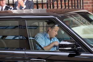 Prince William drive his wife and new baby home from hospital.Photo / AFP
