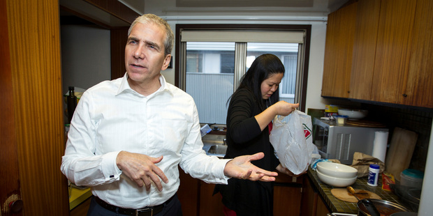 John Palino and fiancee Rose Li at home in their slick Kohimarama apartment. Photo / Michael Craig