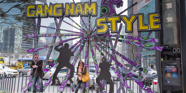 Gangnam Style has overtaken street corners in Seoul; and below, pop star Psy. Photo / AP