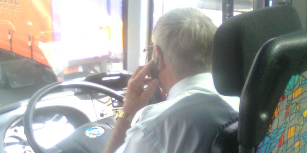 An errant driver pictured using a cellphone at the wheel. Photo / Barry Bloomfield