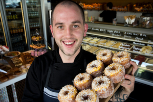 Marc Kinvig, from the Takapuna Beach Cafe, shows off his lemon curd and coconut cro-not. Photo / Greg Bowker
