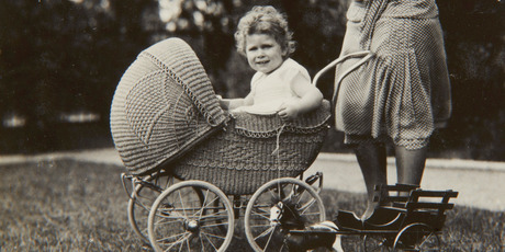 Previously unpublished family photograph issued by the Royal Collection of Britain's Queen Elizabeth II sitting in a wicker pram in 1928.Photo / AP