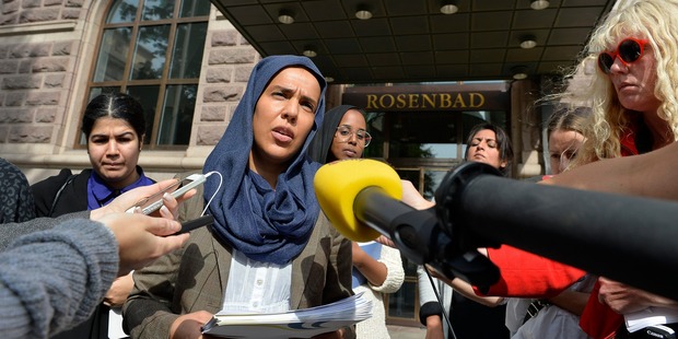 Fatima Doubakil, one of the initiator's of the 'hijab outcry' campaign speaks to media outside the government building in Stockholm. Photo / AP