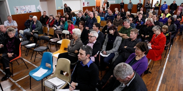 A large crowd listens to speakers air concerns about logging-truck crashes on Otaika Valley Rd. Photo / John Stone