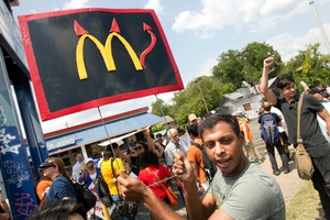 Danny Alvarez protests at a fast food restaurant in Austin, Texas as part of national strikes. Photo / AP