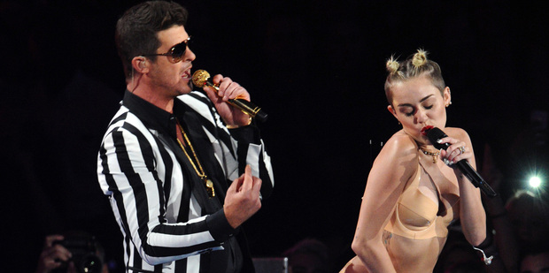 Robin Thicke, left, and Miley Cyrus perform at the MTV Video Music Awards. Photo / AP