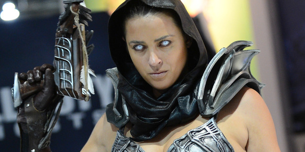 A costumed character appears at the GameStop Expo in Las Vegas on Wednesday. Photo / AP