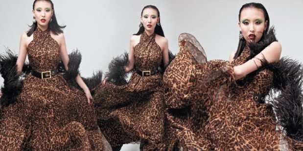 Crystal wears a Gucci jaguar print silk chiffon crossover gown, $8530 and a Gucci wide leather belt, $640. Photo / Mara Sommer