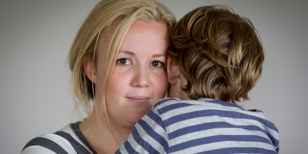 Kimberley Hunter (L) with her son, 6-year-old Oliver, who was left at the side of the road after a school bus run. Photo / NZ Herald