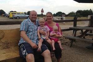 Brendon Watkins, with wife Michaela and children Courtney and Siobhan, wants to stay in Britain
