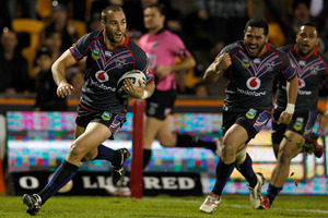 Warriors captain Simon Mannering cruises to the try line against the Raiders last night. Photo / Richard Robinson