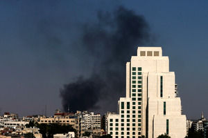 Black columns of smoke rise from heavy shelling in the Jobar neighbourhood in East of Damascus, Syria. Photo / AP