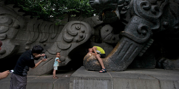 Graffiti referring to Bo Xilai's trial is evident on a stone tiger statue in a park in Jinan, in eastern Shandong province. It reads: "Without Bo to monitor civil affairs, Separate lots in jail, isolated trial accounting of problems." Photo / AP