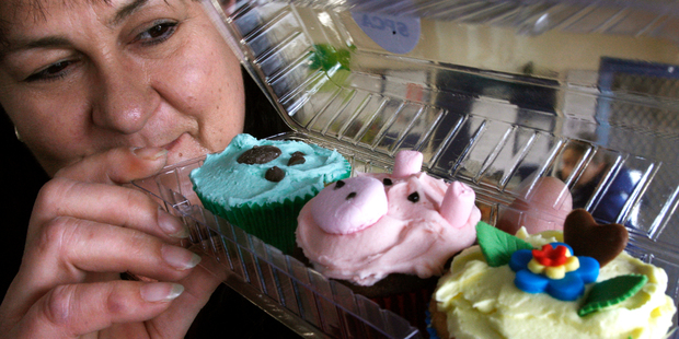 Whangarei SPCA centre team leader Andrea Honeybun with the some of the cupcakes that were on sale at Cameron St Mall yesterday as part of the SPCA Cupcake Day. Photo / John Stone