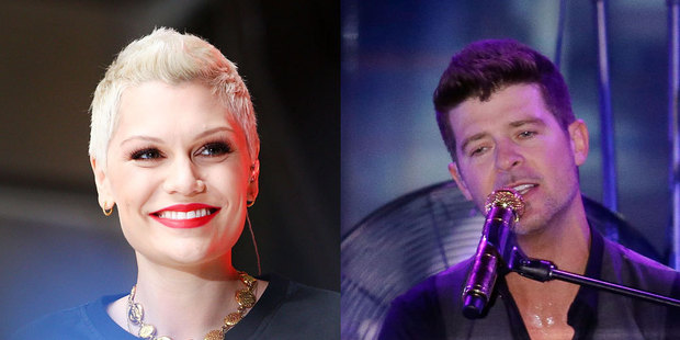Jessie J, left, says she won't be quick to take her clothes off in the video for her 'Calling All Hearts' collaboration with Robin Thicke. Photos / Getty Images