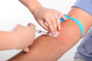Dunedin police officers and a prison officer must wait several months for blood test results after being spat at by two offenders. Photo / File Photo / Thinkstock