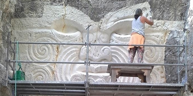 Paora Toi Te Rangiuaia is close to finishing his carving at Les Lapidiales in the Port d'Envaux village, France.