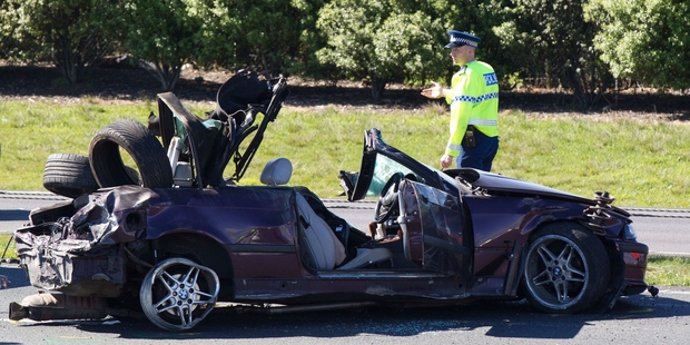 The BMW lies wrecked on the motorway. Photo / Richard Robinson