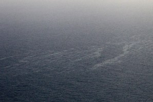 An aerial picture shows a vast liquid hydrocarbons spill off the western coast of Corsica. Photo / AFP