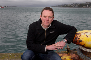 Helicopter pilot and former surf lifesaver Riley Massey on the wharf where he rescued a drowning man from Wellington Harbour. Photo / Mark MItchell
