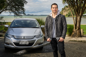 Jared Turner says his Honda Insight is fuel efficient, comfortable and has room for the family.Picture / Ted Baghurst