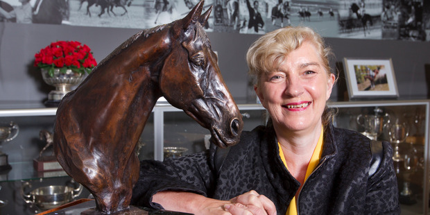 Frances Stead shows off the bronze sculpture of Jock Paget's Badminton winning horse, Clifton Promise. Photo / Mark Mitchell