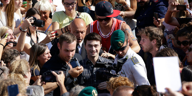 Actor Daniel Radcliffe is mobbed by fans as he leaves a press conference for his film 'Kill Your Darlings' at the 70th edition of the Venice Film Festival. Photo / AP