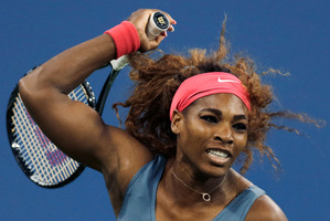 Serena Williams showed no mercy to birthday girl Cala Suarez Navarro, winning, 6-0, 6-0. Photo / AP