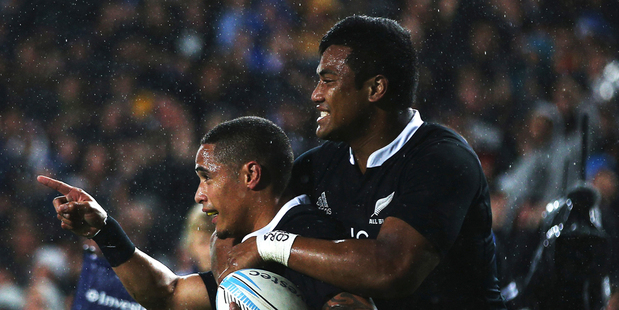 Aaron Smith of the All Blacks celebrates with Julian Savea of the All Blacks after scoring his first try during the Rugby Championship. Photo / Getty Images.